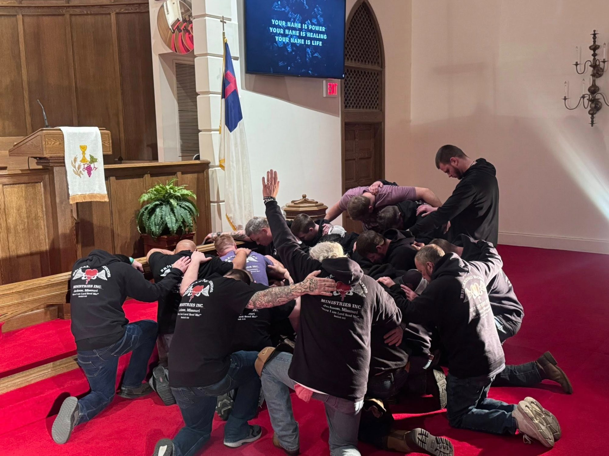 Breaking Bonds men at the altar in prayer