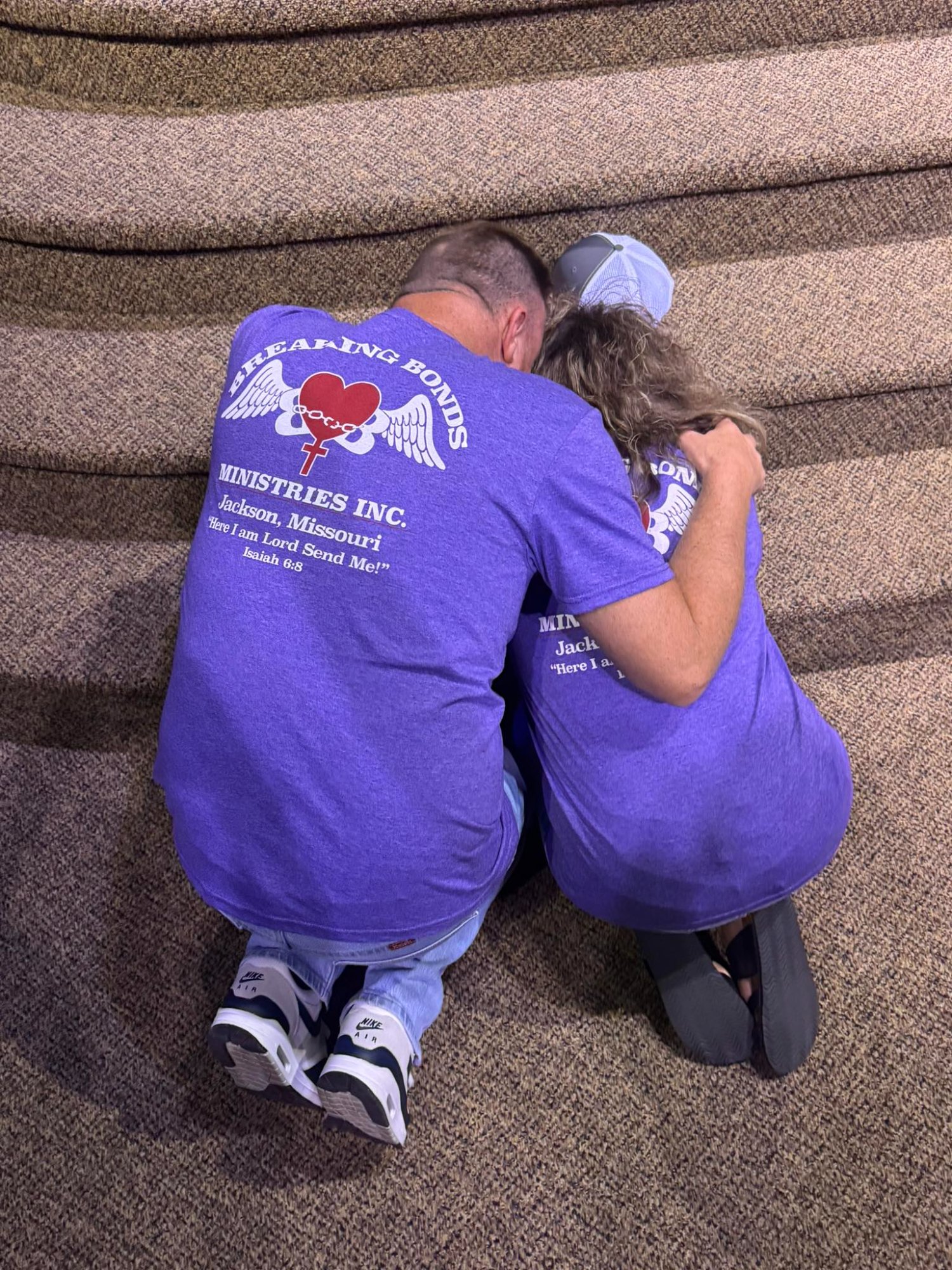 Ryan and Julie Boswell in prayer